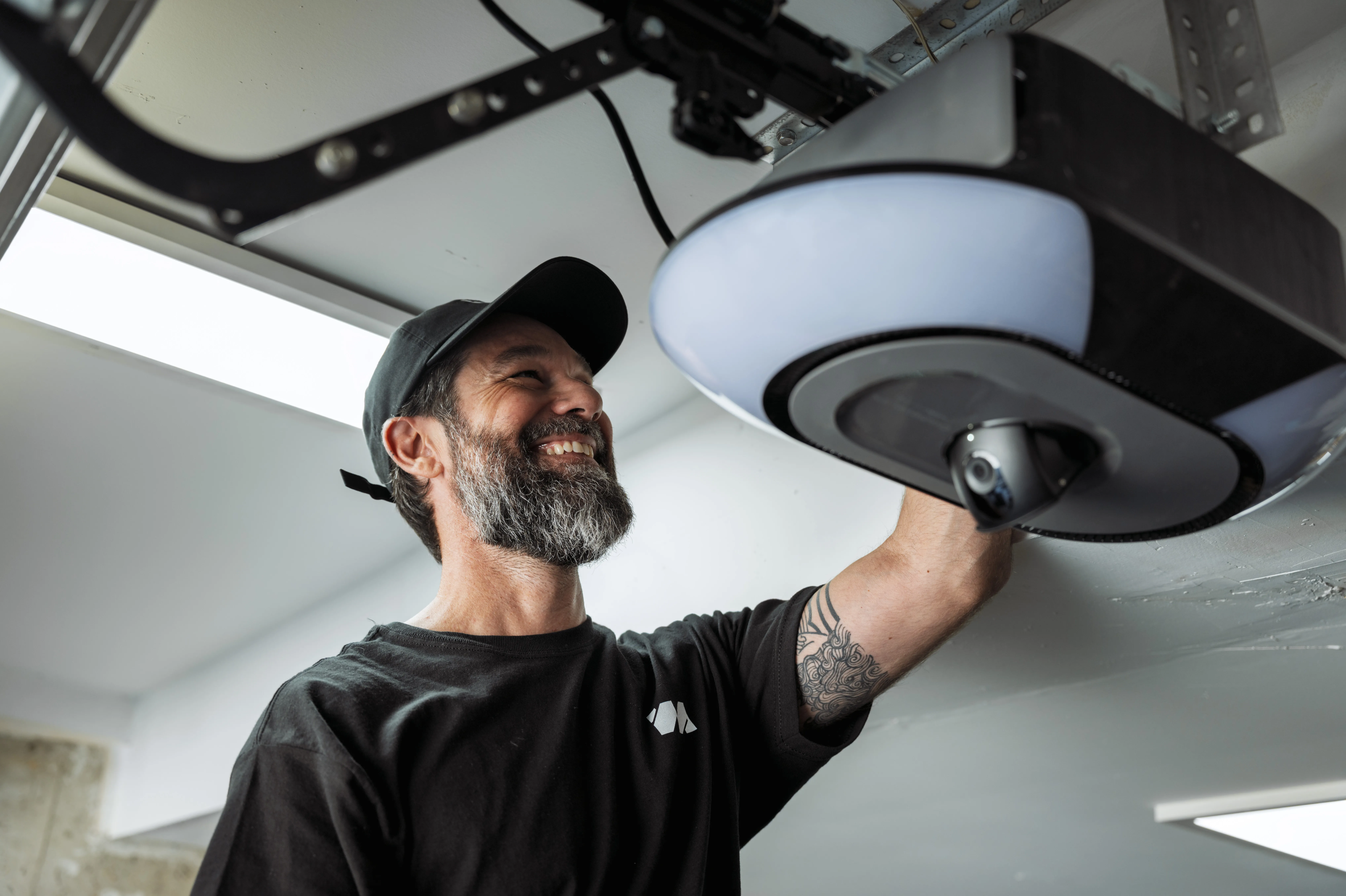 Garage door technician programming a garage door opener